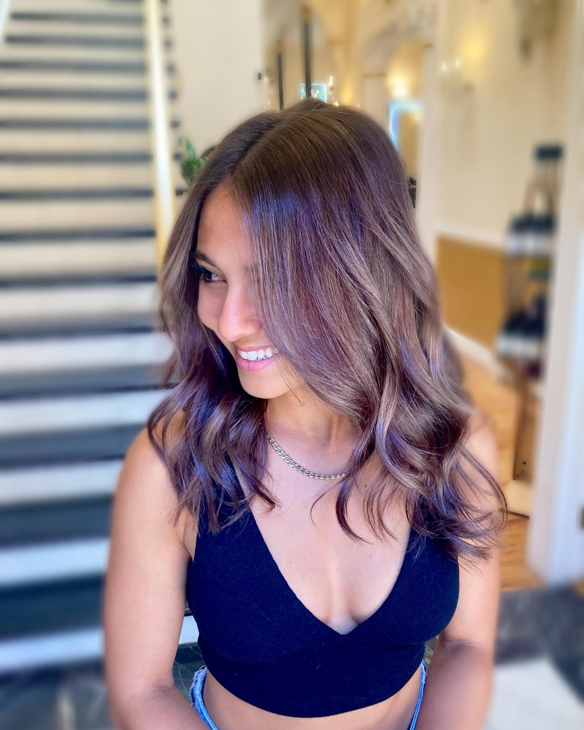 Balayage foils being applied to brunette hair at Fluff Denver